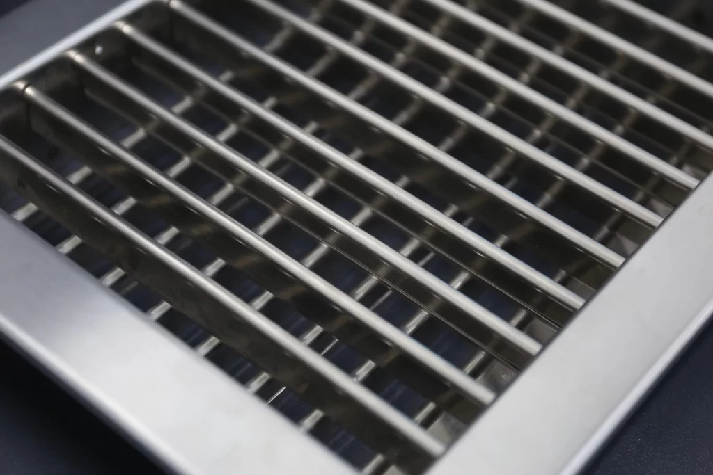Perforated stainless steel air grille designed for cleanroom HVAC systems, ensuring hygienic airflow distribution and easy cleaning.