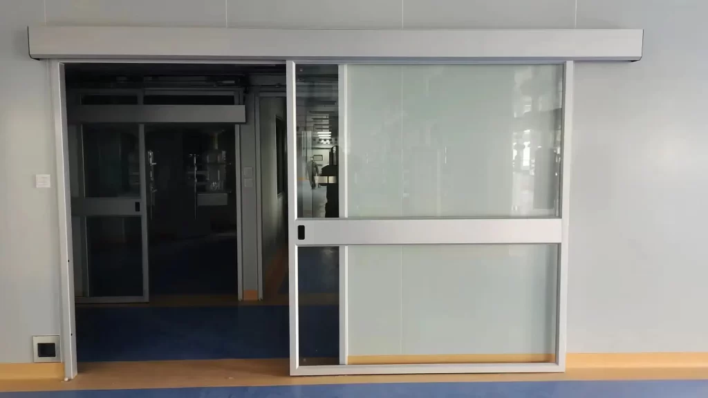Industrial Sliding Doors with sealed vision panels for hospital cleanrooms and sterile medical zones.