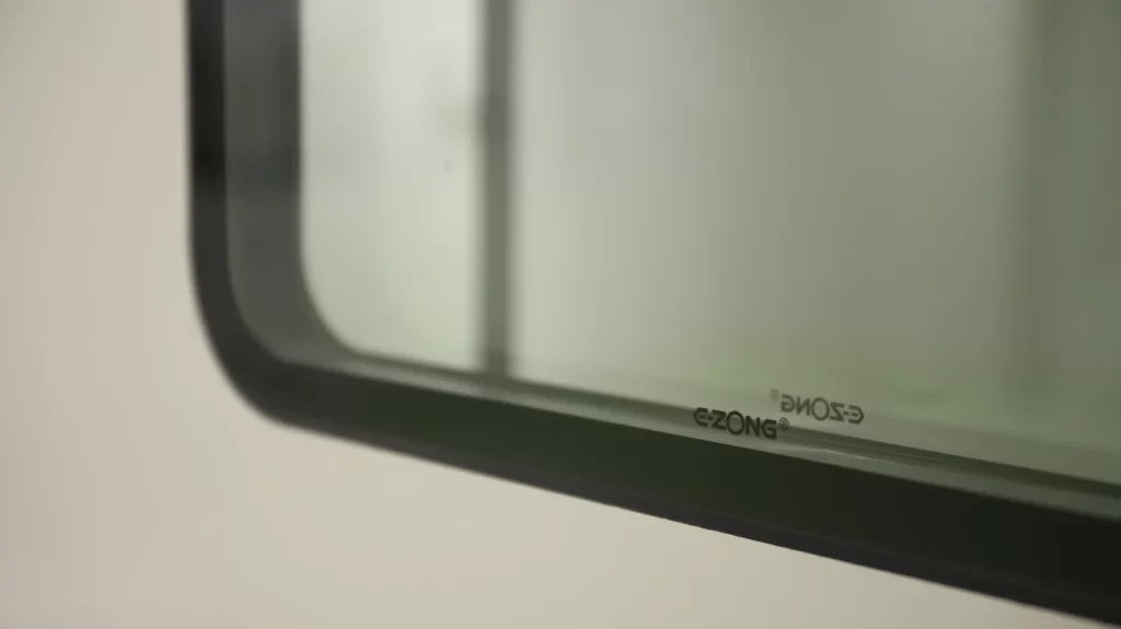 E-ZONG brand logo visible on cleanroom window glass, manufacturer specializing in cleanroom doors and aluminum profiles for pharmaceutical and medical facilities
