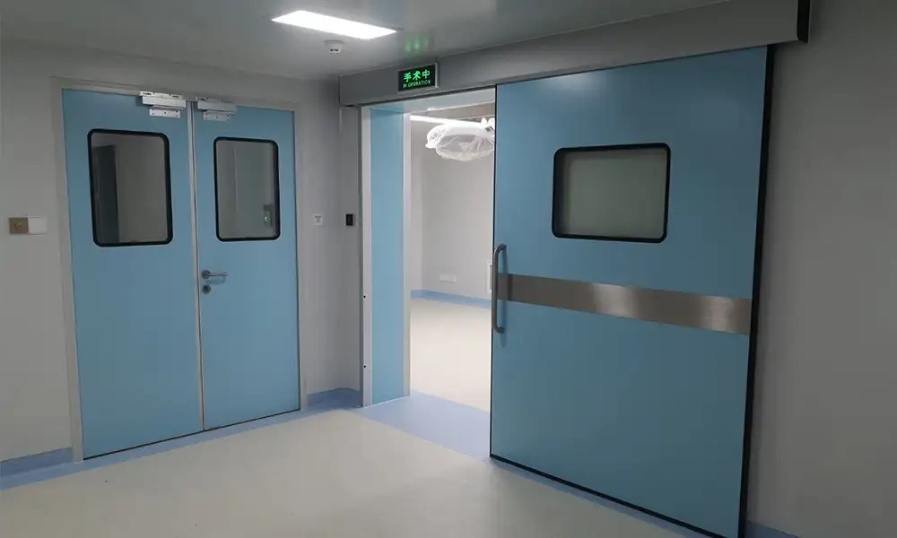 Side-by-side view of blue cleanroom swing and sliding doors in a GMP-regulated facility.