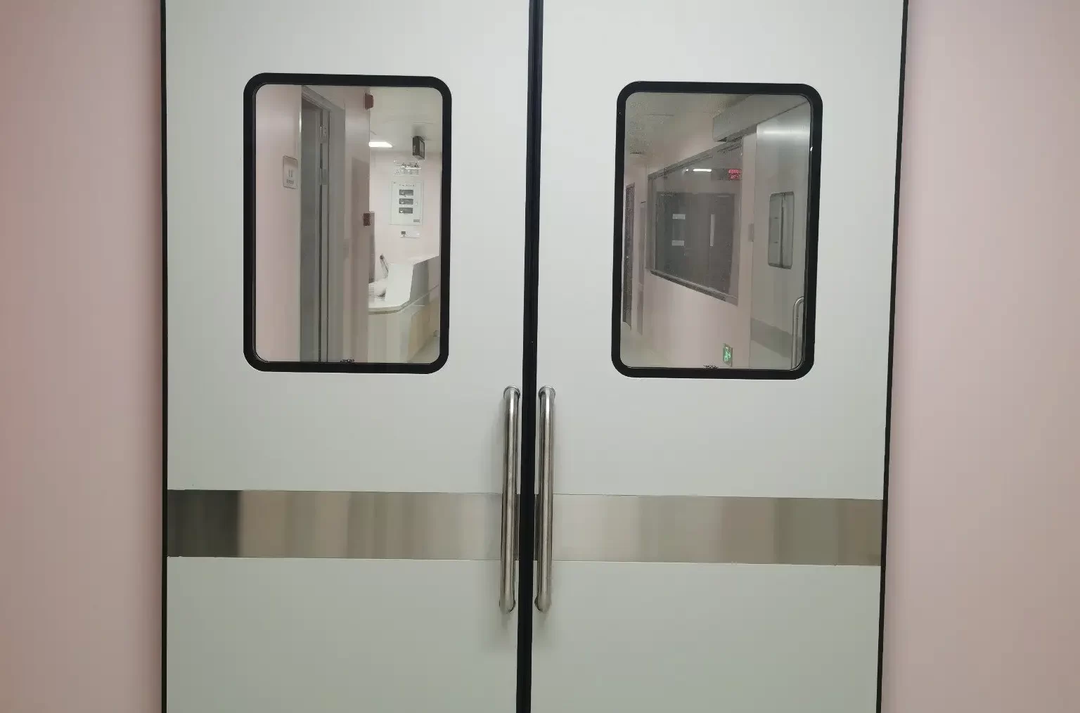 Cleanroom double sliding doors with vision panels and stainless steel kick plates